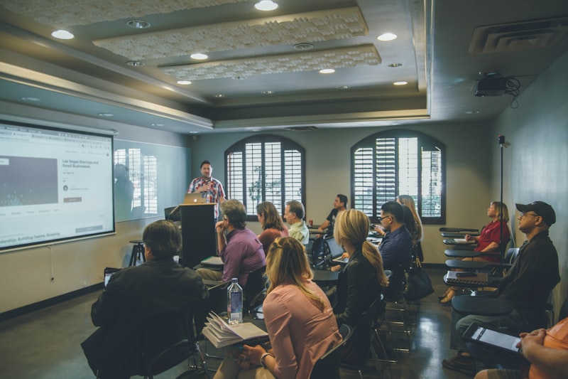 Attendees seated in a lecture hall during a continuing education session